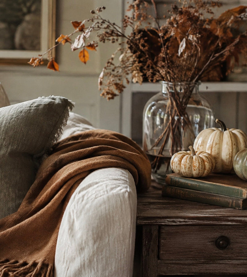 Living room styled for fall with warm natural light